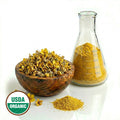 Wooden bowl with dried Mulein flowers, a beaker glass container with yellow powder substance, and USDA Organic label on a white background.
