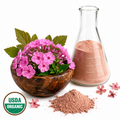 Phlox Pink flowers in a wooden bowl next to a glass flask with pink powder and the USDA Organic seal on a white background.