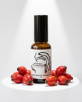 Bottle of Muskoka Wild Harvest Organic Roschip Vitamin C on a white background with rosehips.