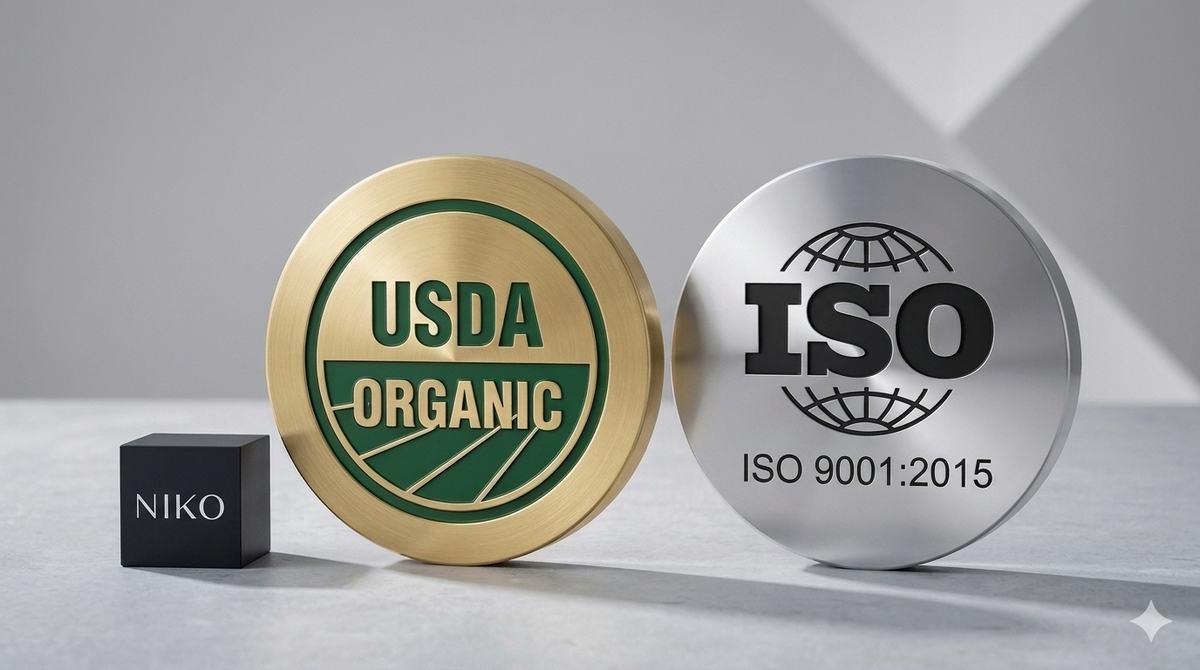Gold USDA Organic label and silver ISO 9001:2015 label on a gray background with NIKO box.